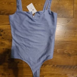 Cute dusty blue body suit with V in the middle